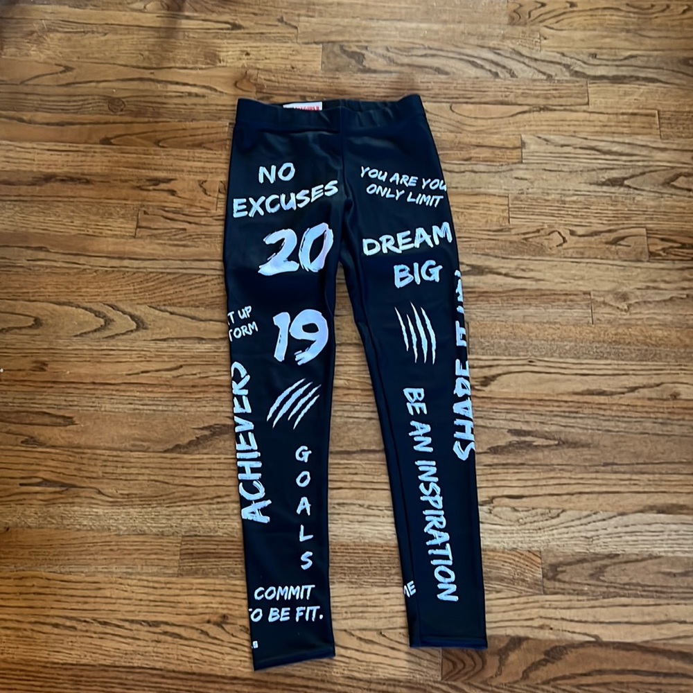 US fitgirl sz.  Size small; Black leggings with white lettering.